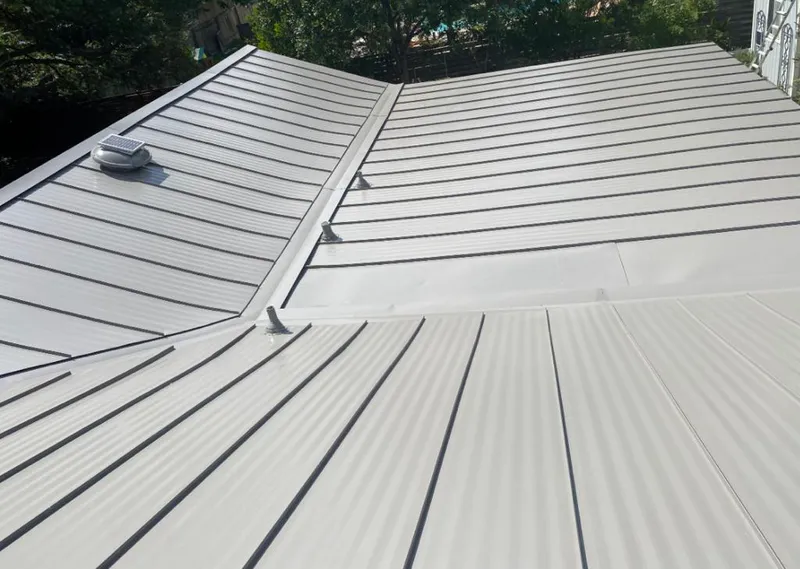 Solar attic fan installed on a metal roof for Roof Ventilation in Sebring